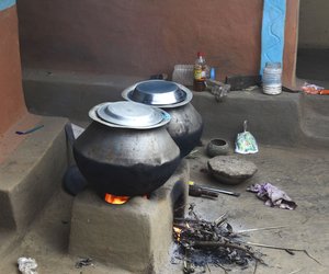 Food being cooked on earthen stove