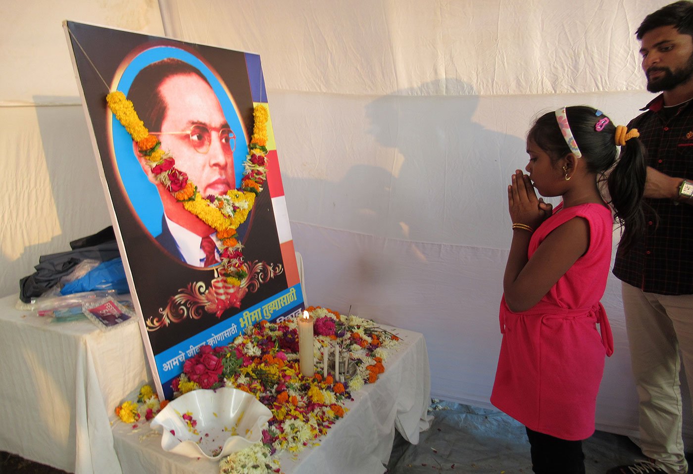 Girl offering tribute to Dr. B. R. Ambedkar on the occasion of his death anniversary in Mumbai