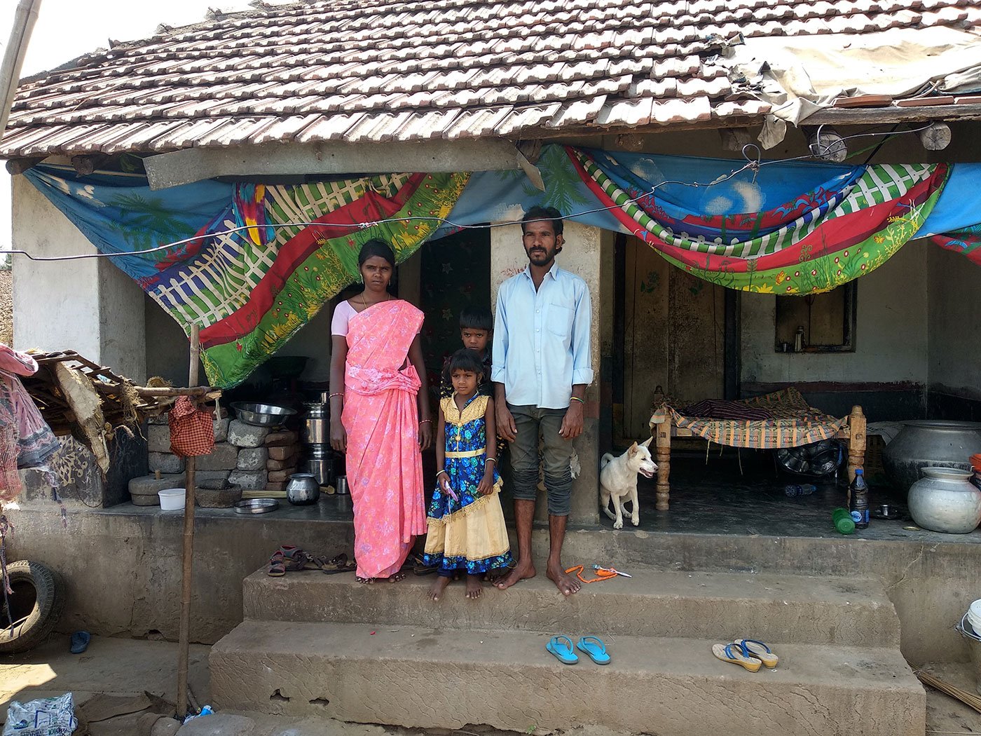 Sridevi, Smiley, Prashanth and Suryachandram, in front of their house in Pydipaka