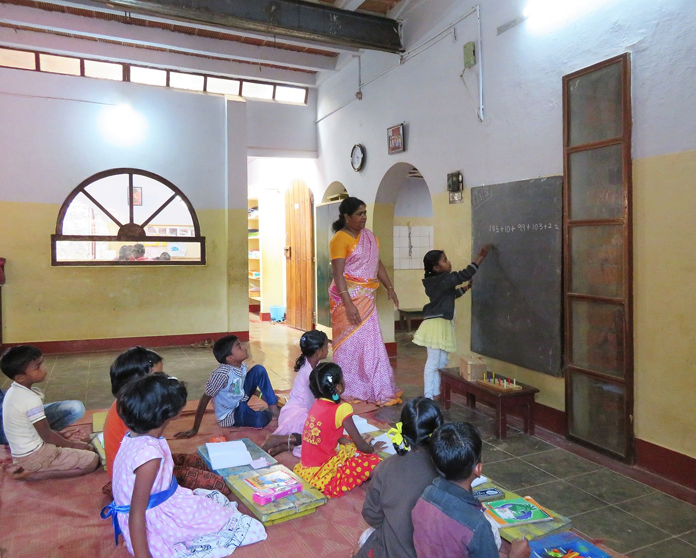 Shanthi Kunjan teaching her class in school