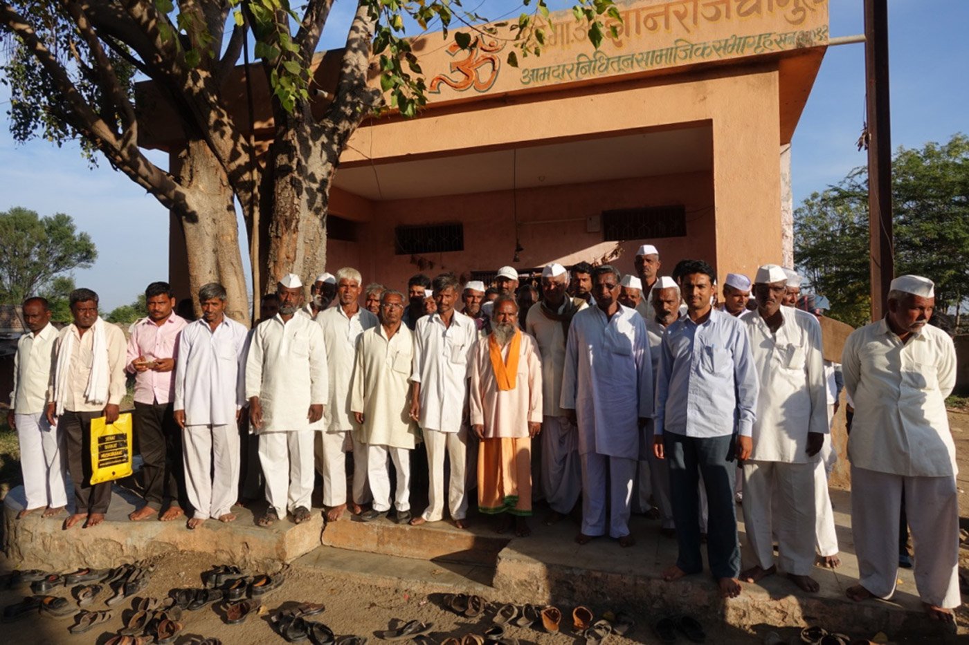 Farmers standing in front of Osamabad District Central Operative Bank