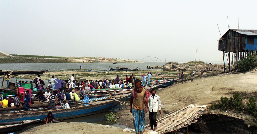 Workers arriving from the different islands on the Brahmaputra river to work in Dhubri town.
