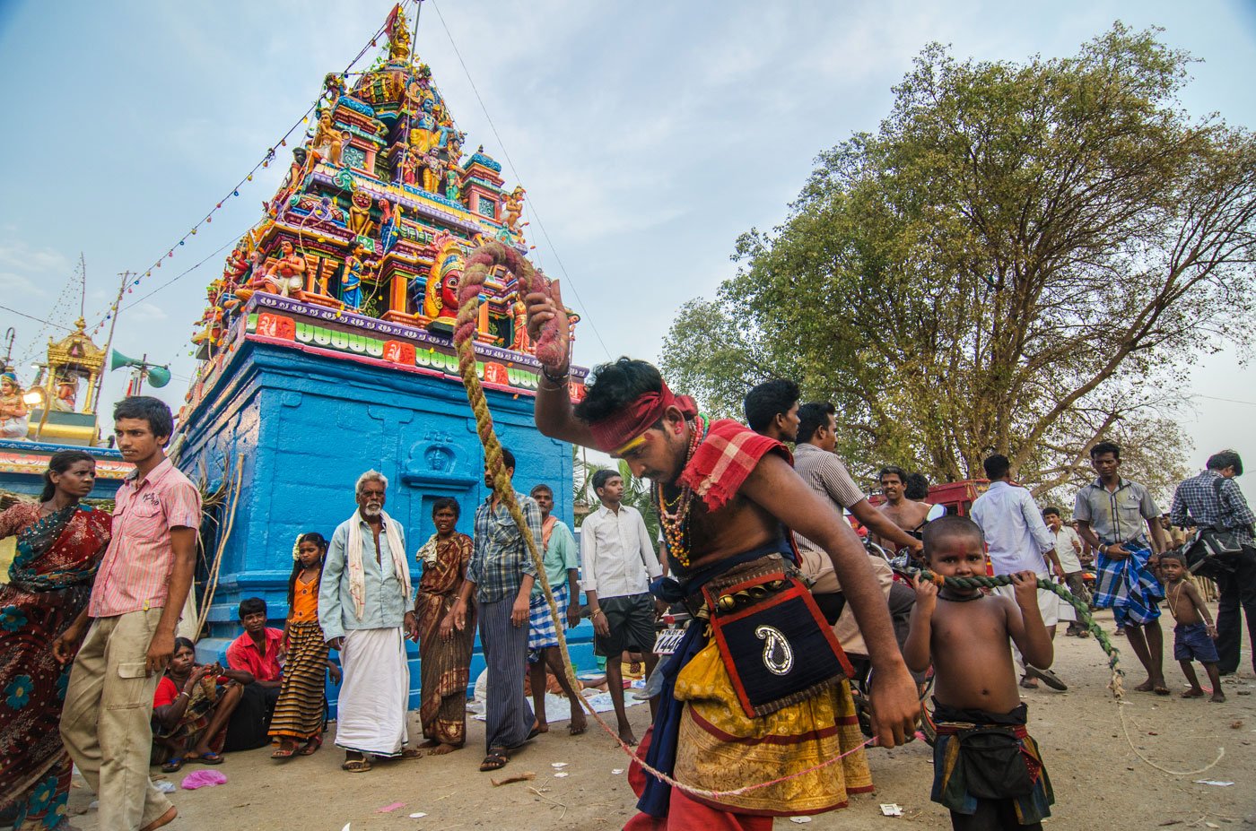 The temple dedicated to Lord Aravan (known locally as Koothandavar) is in Koovagam village, about 30-40 kilometres from Viluppuram town in Tamil Nadu. A man whipping himself in front of a temple.