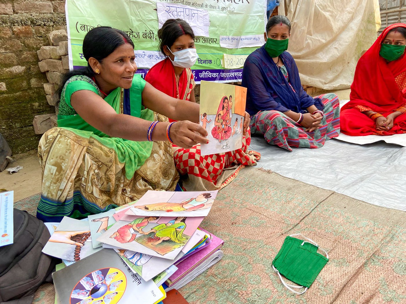 Health workers with display cards at a meeting of young mothers in a village in Purnia. Mostly though everyone agrees that the bride’s bhabhi is the correct source of information on such matters