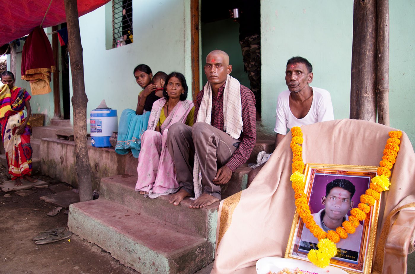 Namdev Soyam, with his parents, Bhaurao and Babybai, mourning the death of his younger brother, Pravin, at their home in village Tembhi of Yavatmal in September 2017