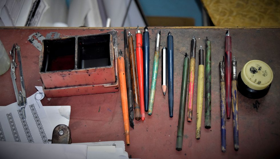 Calligraphy pens lying on the table