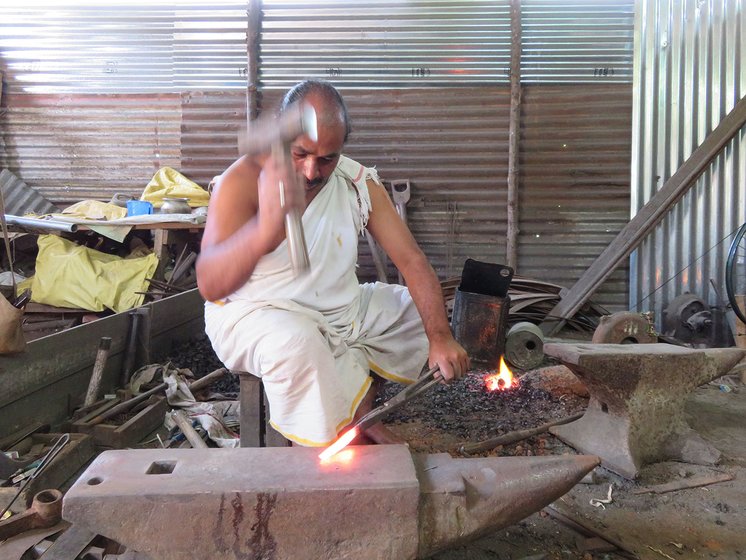 N. Mohana Rangan beating the red hot iron with his hammer