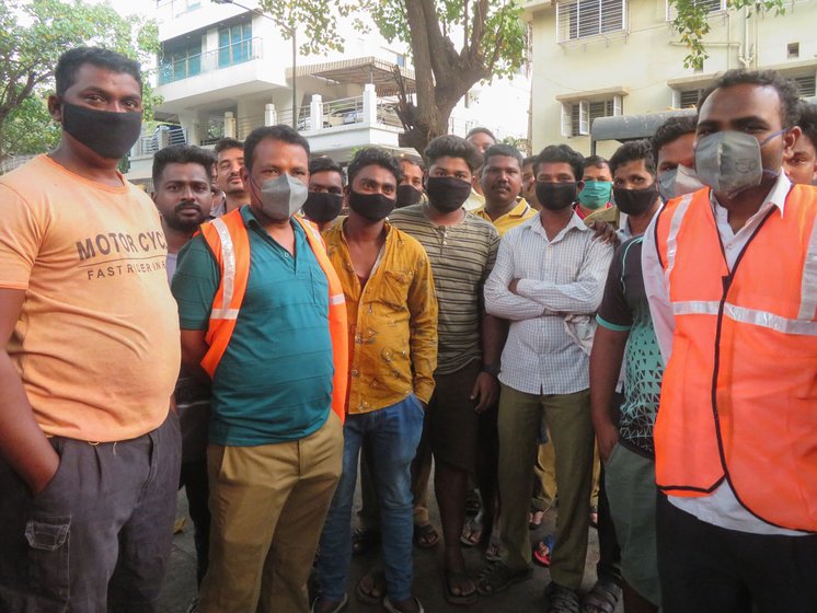 Left: On Saturday, like on all their work days, safai karamcharis gathered at 6 a.m. at the chowki in M-West ward, ready to start another day of cleaning, at great risk to themselves. Right: Among them is Anita Ghotale, who says, 'We got these masks only yesterday [on March 20], that too when we demanded them due to the virus'

