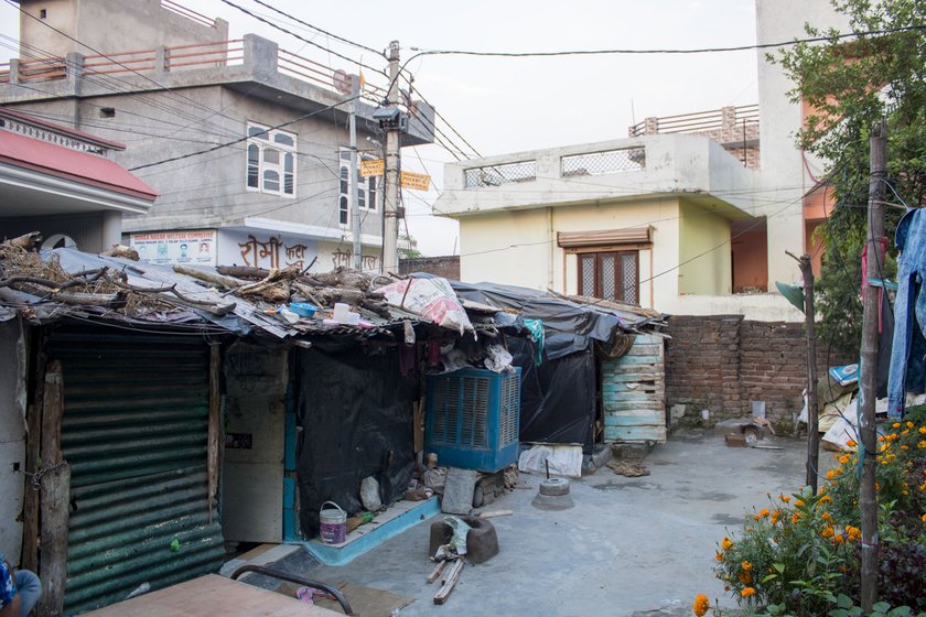 People in nearby buildings gave rations to the labourers living in the three rooms (left) in a back lane in Jammu city. Mohan Lal (right) resides in one of the rooms


