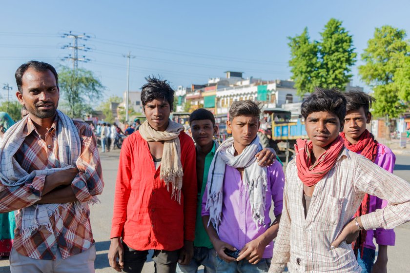 Young men wait for contractors at the labour naka in Udaipur. At least one male from most of the families in the district migrates for work (file photos)

