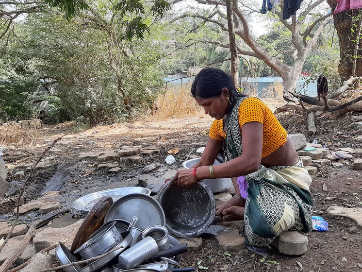 Maya Mohite washing the utensils. This is in the same area where her tent is set up. 