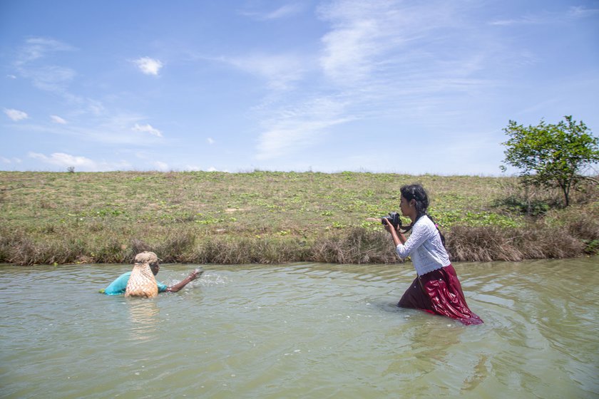Right: Hairu Nisha taking pictures in Kosasthalaiyar river near Chennai.