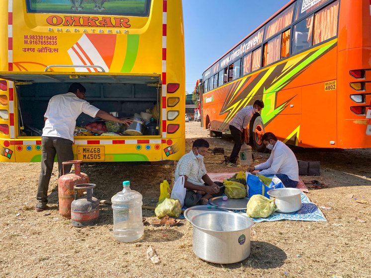 The bus is stacked with onions, potatoes and rice, among other items. When activists leading the march stop, Bhagat and his colleagues get to work