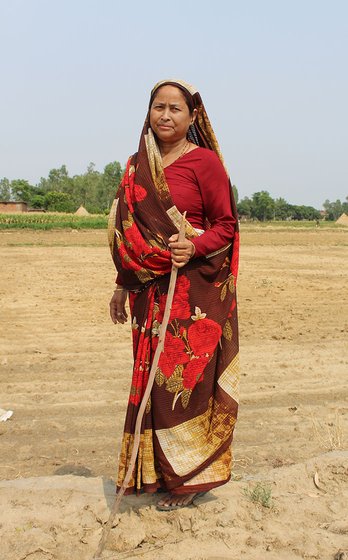Kamla Devi stands on her farm in the village of Pindari (Udham Singh Nagar), Uttarakhand