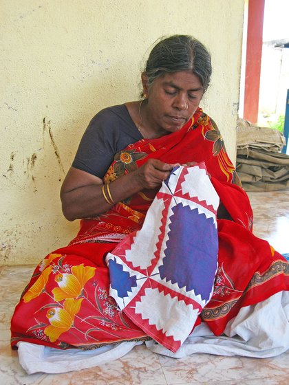 Woman sewing a piece of cloth