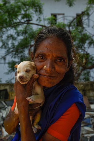 Rita akka cannot speak or hear; she communicates through gestures. Her smiles are brightest when she is with her dogs

