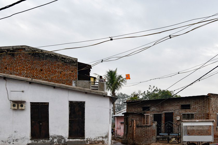 A lone boy flying a lone kite in the town's Akbarpur locality