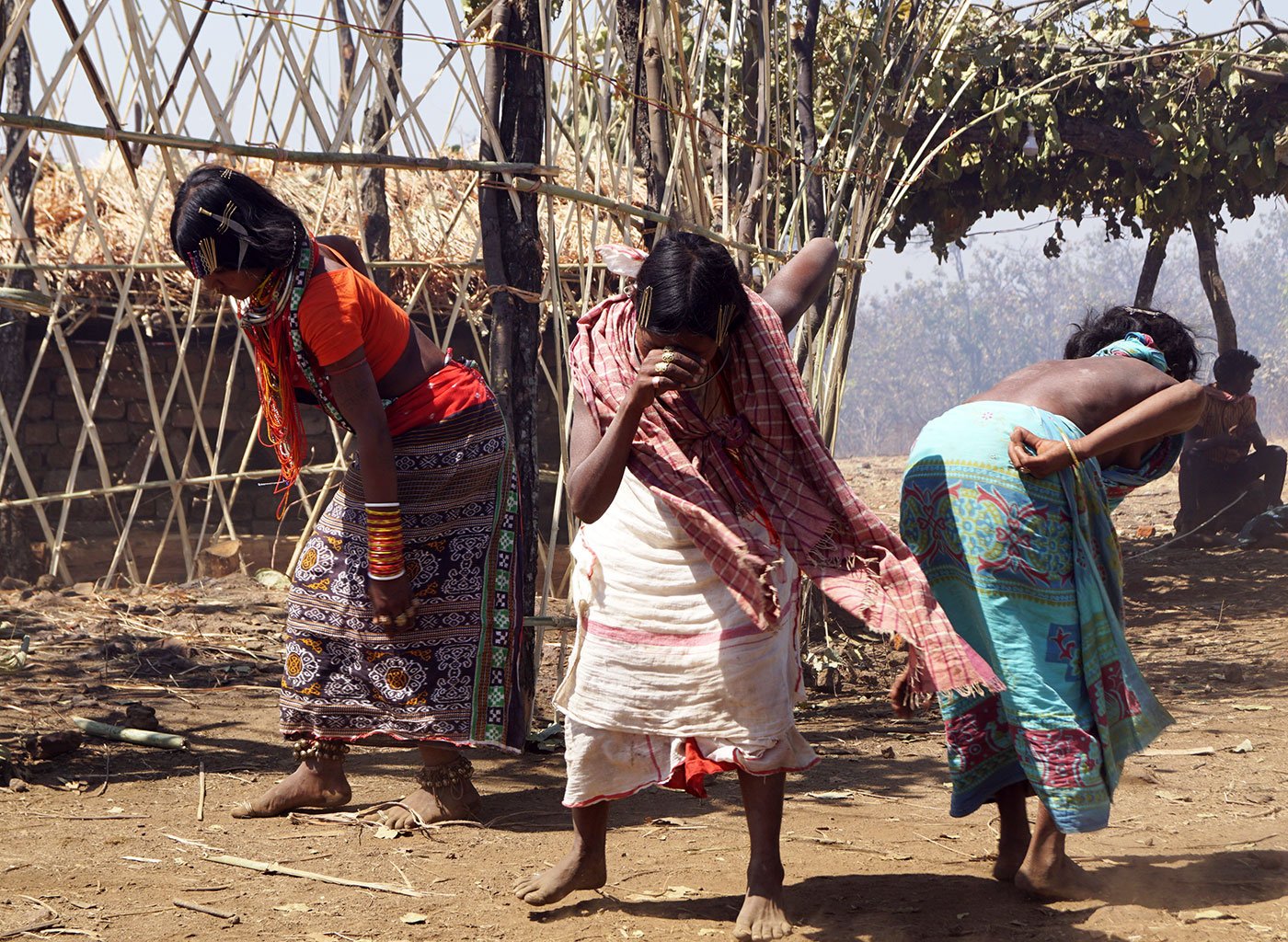 Three tribal women, who are priests, dancing after conducting their rituals