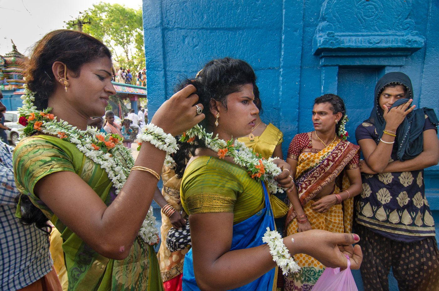Aravanis enact a story from the Mahabharata in which they get married to Lord Aravan. Here, they are seen getting ready for the wedding. A transgender woman decorating another transgender's hair with flowers
