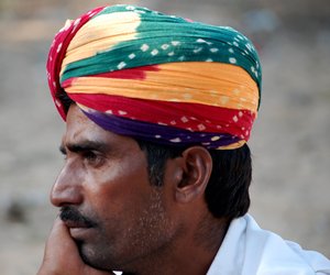 Man with a colourful head gear