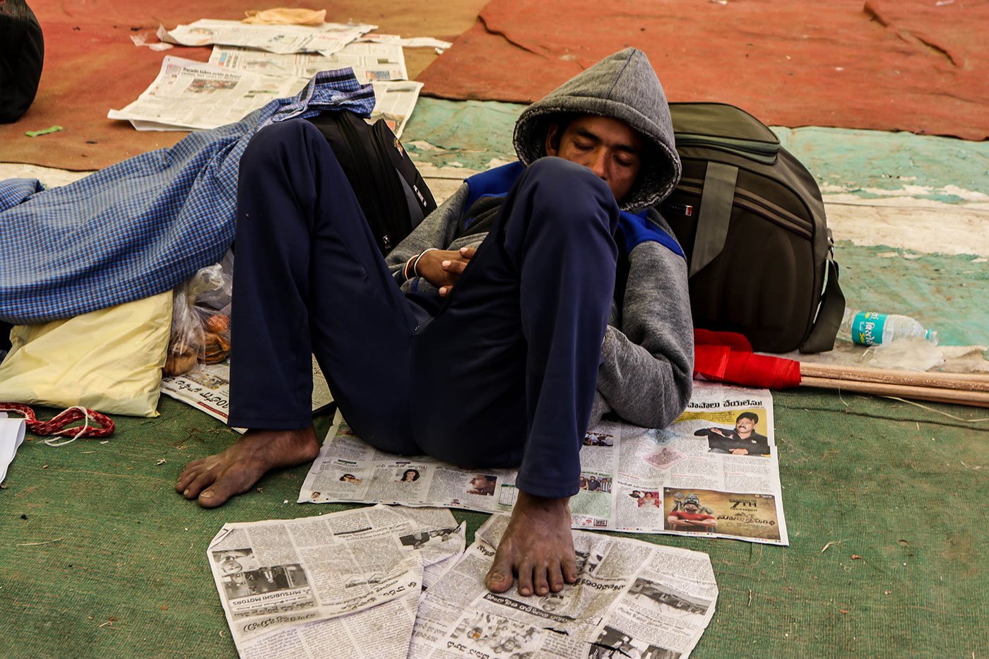 A young farmer sleeping in the Ram Leela Maidan