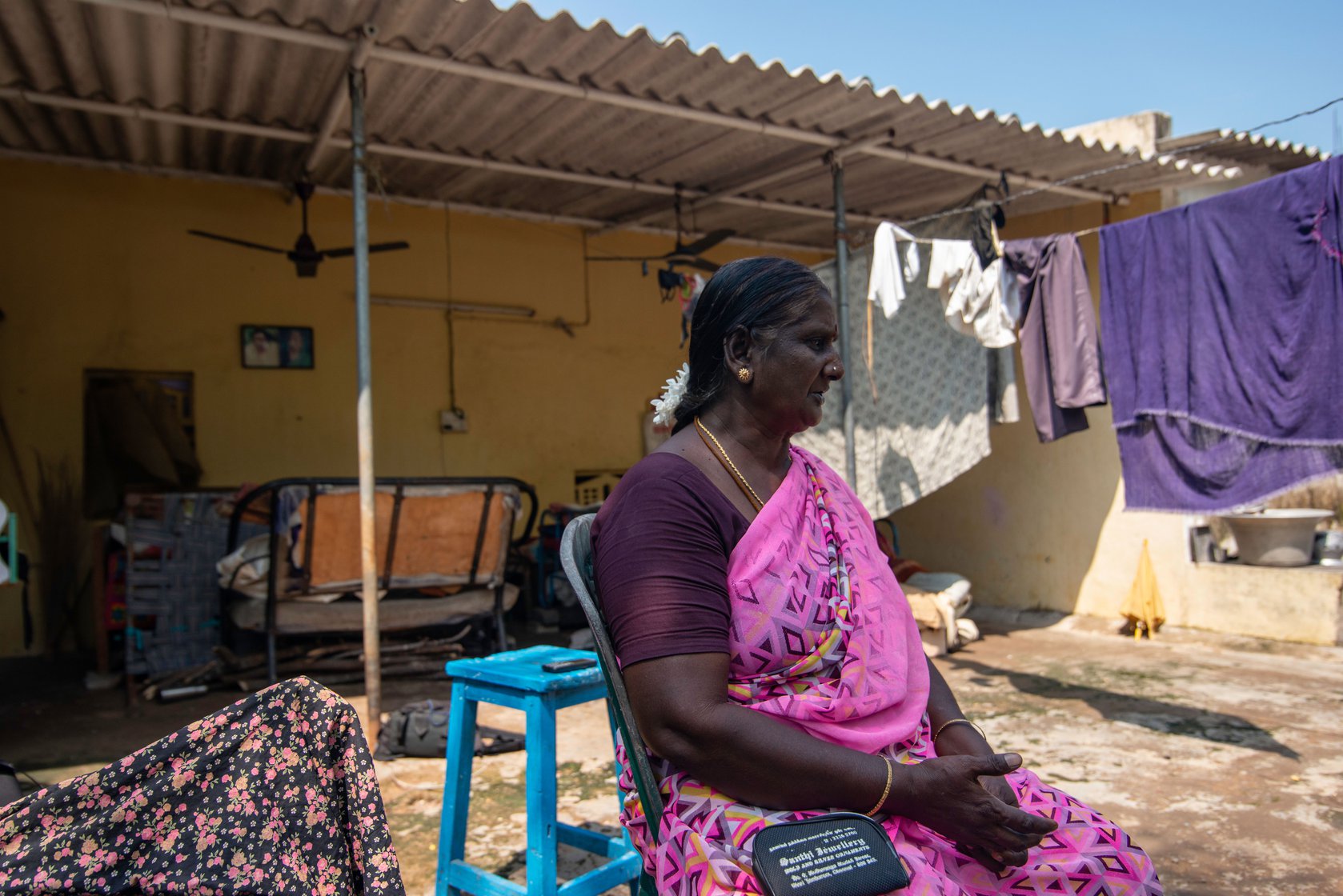 Shanthi akka sitting outside her home in Kondangi. With her earnings from doing health work in the community, she was able to build a small one-room house. She was the only person in her family with a steady income until recently