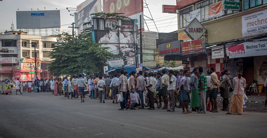 Tamil and Telugu migrants waiting for work in the morning at Kaloor.
