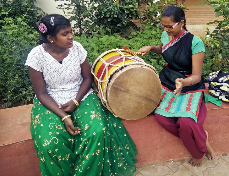 Kavya V (left) and Narsamma S (right) playing the drums
