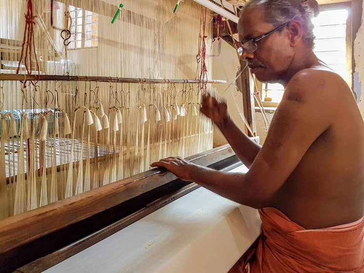Mani K. who has been in this profession for over 30 years, works on the handloom