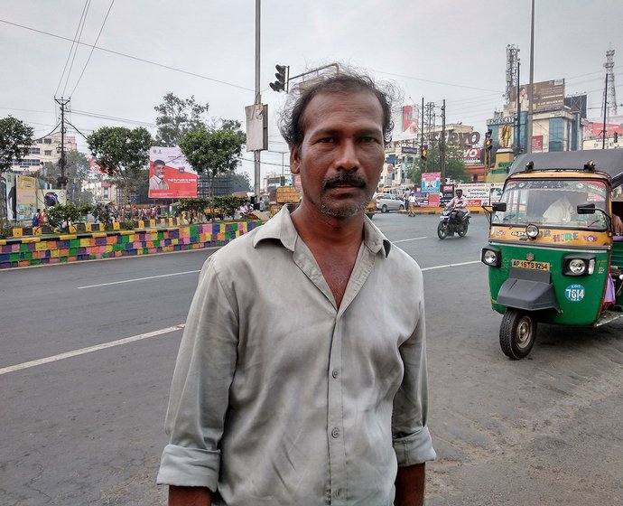 A man standing on a street in Vijaywada