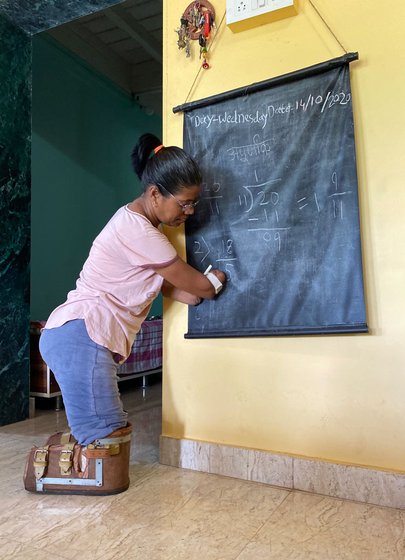 'When the doctors first told me about the operation I went into shock... Since then, every small task takes longer to complete. Even writing with this chalk is difficult'

