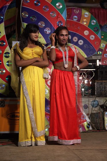Male artists dressed as women during the performance in Gogolwadi village, Pune district