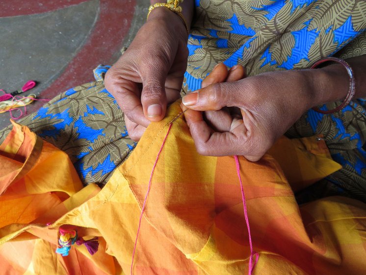 Woman stitching a design