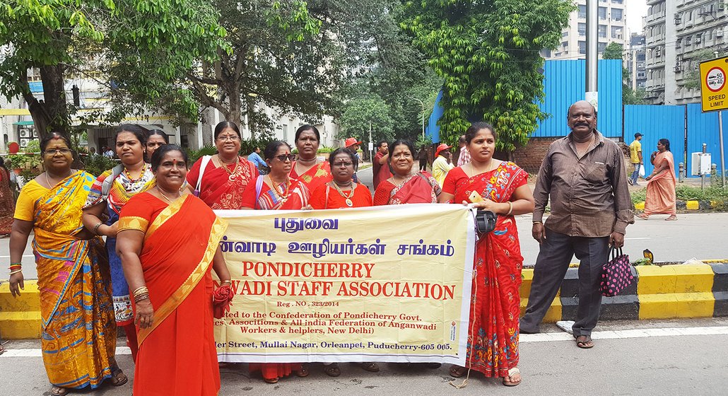 Tamilarasi (front) and her colleagues from the Pondicherry Anganwadi Staff Association, pose for a cheerful picture, after recounting their grievances over the rapid informalisation of anganwadi workers