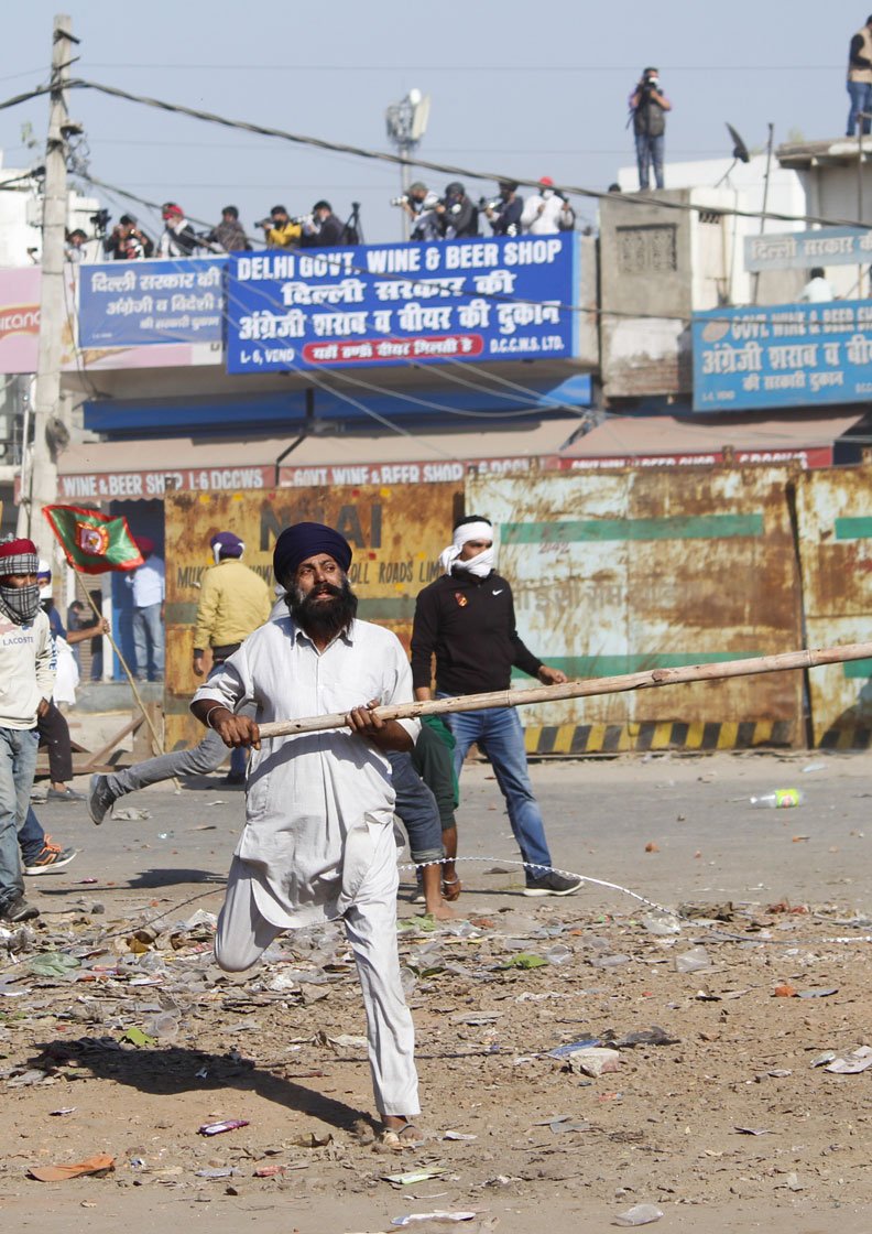 November 27: 'When protestors block a road or damage it, they are branded as criminals. What if governments do the same? Are they not what they call us?' asks 70-year-old Harinder Singh Lakha (not in these photos) from Punjab's Mehna village

