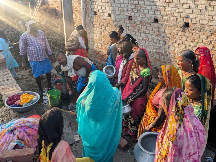 Right: In Bihar's Nalanda district, women wait with their utensils to get water from the only hand pump in the Dalit colony of Akbarpur panchayat