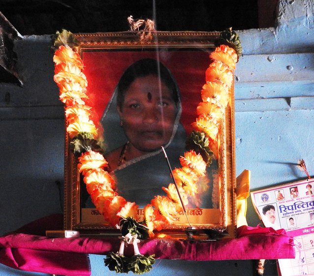 Framed photo of Shahu Kamble with garland
