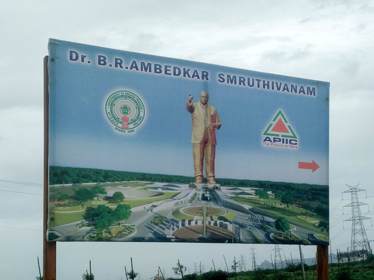 A signboard showing the directions to the yet to be constructed Ambedkar Smriti Vanam