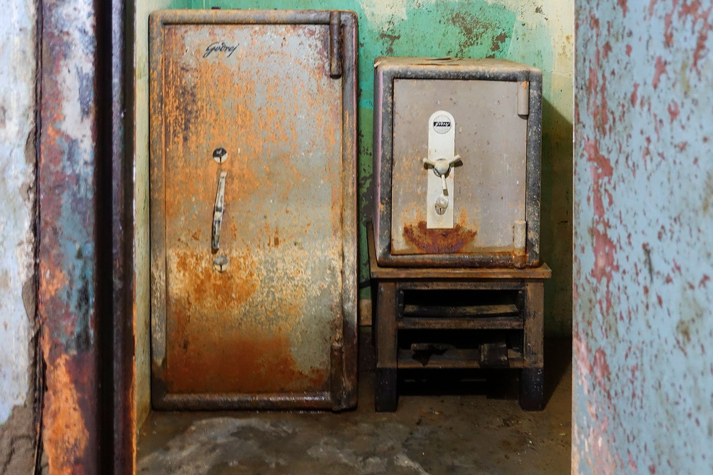 Two cast-iron safes bear the rust, corrosion and marks wrought by the waters that engulfed them.