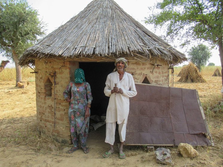 Bajrang Goswami and Raj Kaur (left) say their 'back has burnt with the heat', while older farmers like Govardhan Saharan (right) speak of the first rains of a different past

