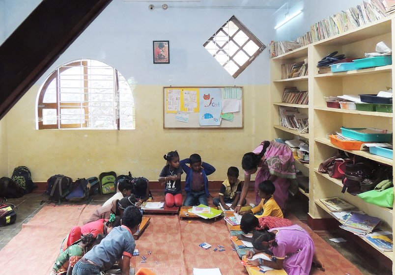 Adivasi children learning in a classroom