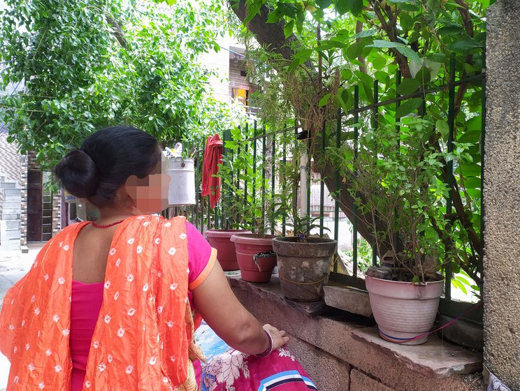 Geeta (in orange) is the overseer of sex workers in her area; she earns by offering her place for the women to meet clients

