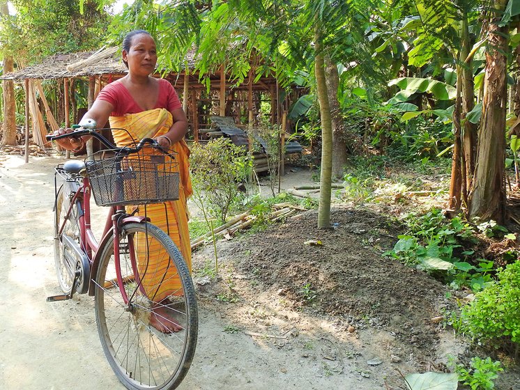 Sama heads to the market on her bicycle