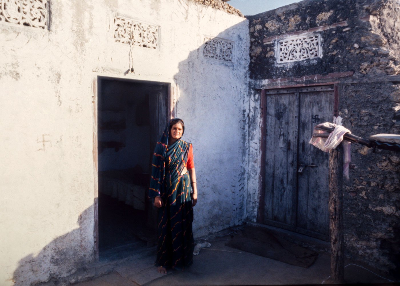 Anju Phulwaria, the persecuted sarpanch, standing outside her house