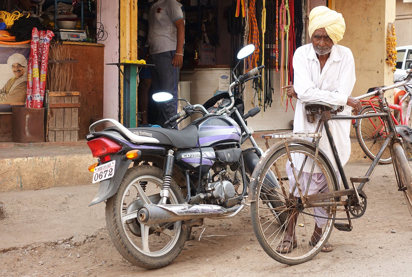 Ganpati Bala Yadav with his cycle outside a shop