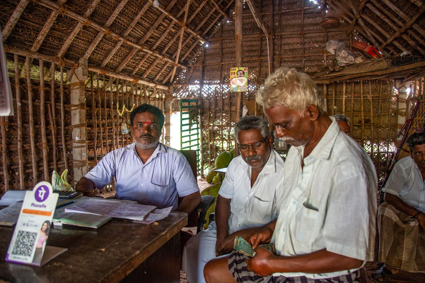 Vijaykumar (extreme left ) at his shop with farmers who have come to sell their jackfruits