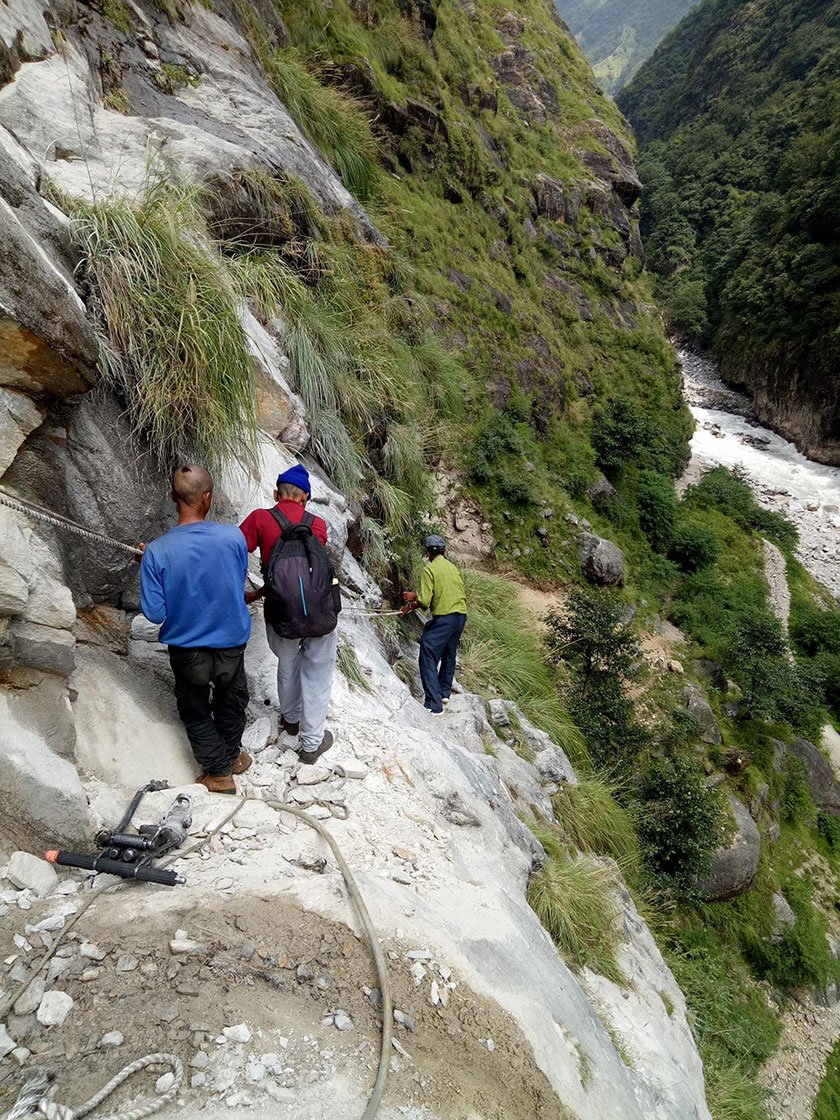 When a landslide washed away the route in Malpa in August 2017, residents walked by holding ropes.