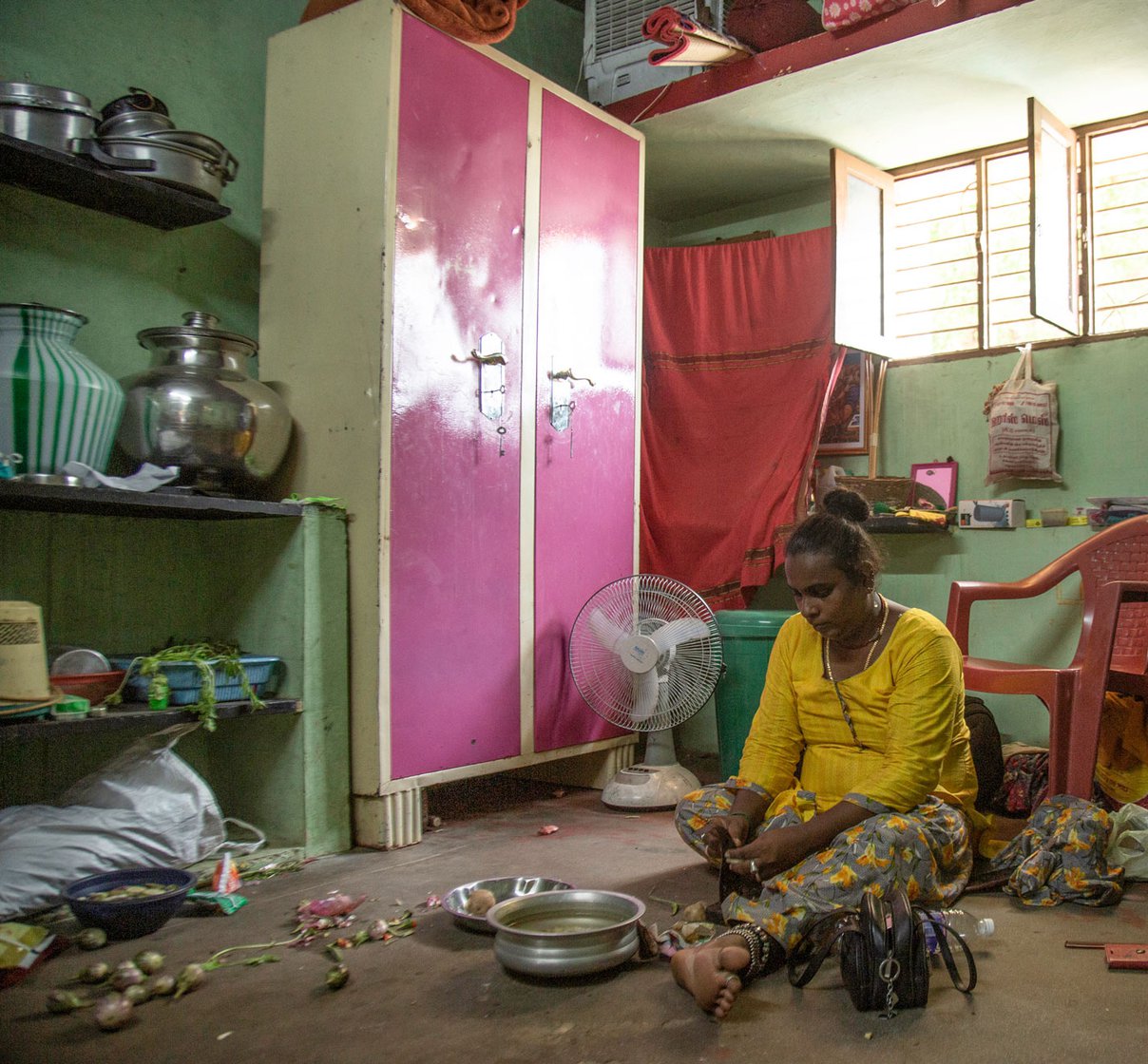 At Magie's room, V. Arasi helping cook a meal: 'I had to leave home since I was a trans woman' says Magie (right)