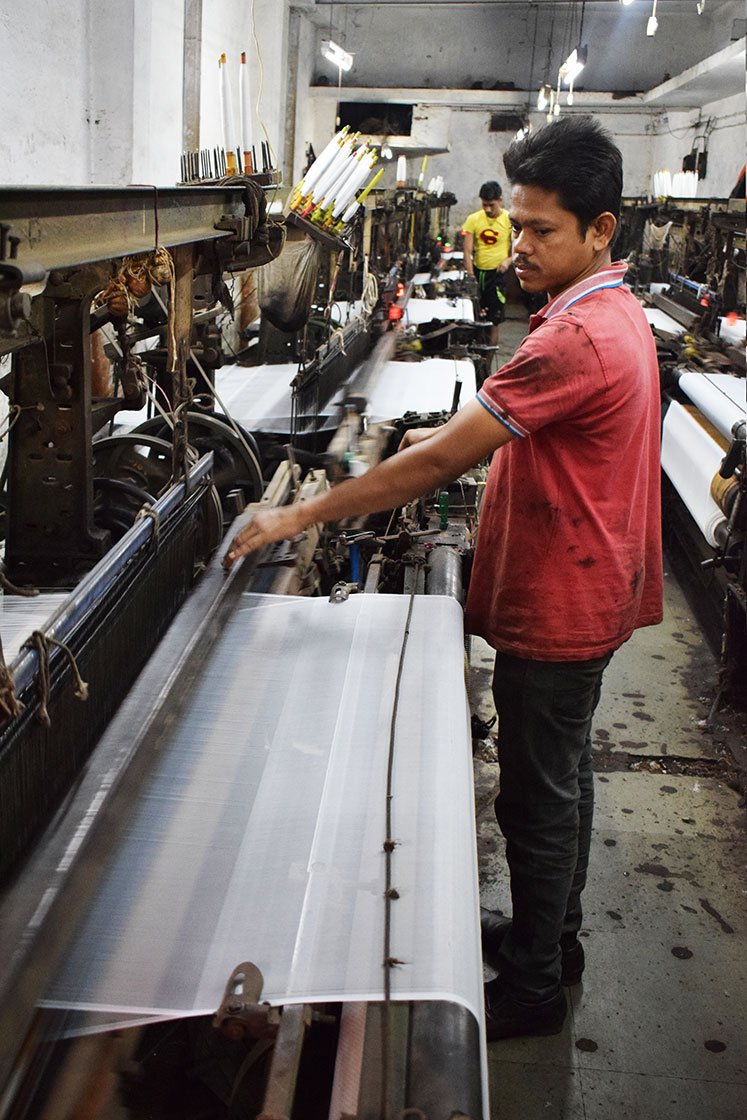 Simanchala Sahu, a migrant worker from Odisha’s Ganjam district has been working in a powerloom unit on Ved Road for the last two decades. He works for 12 hours every day, and gets paid on a piece-rate basis