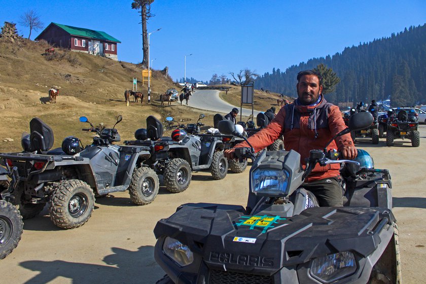 Left: 'People don’t want to ride ATV on the road, they like to ride it on snow,' says Mushtaq Bhat, an ATV driver in Gulmarg.